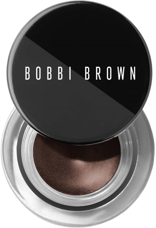 En Bobbi Brown øyeskyggekrukke med svart lokk og skinnende mørkebrunt øyeskugg inni.
