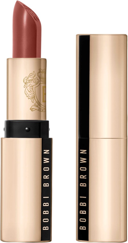 A lipstick in a gold case, partially open revealing a pinkish-brown lipstick inside.