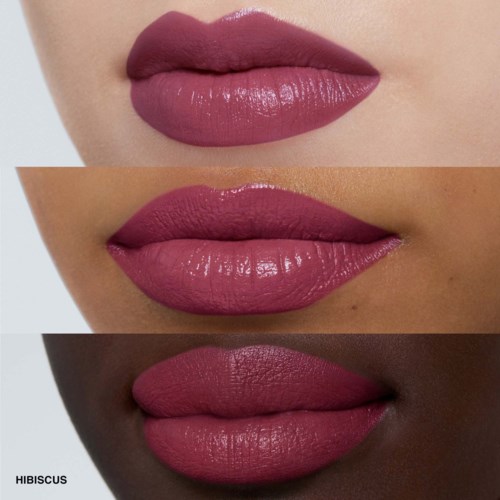 Three women with different skin tones wear matching pink lipstick. They show close-up of lips in various lightings.