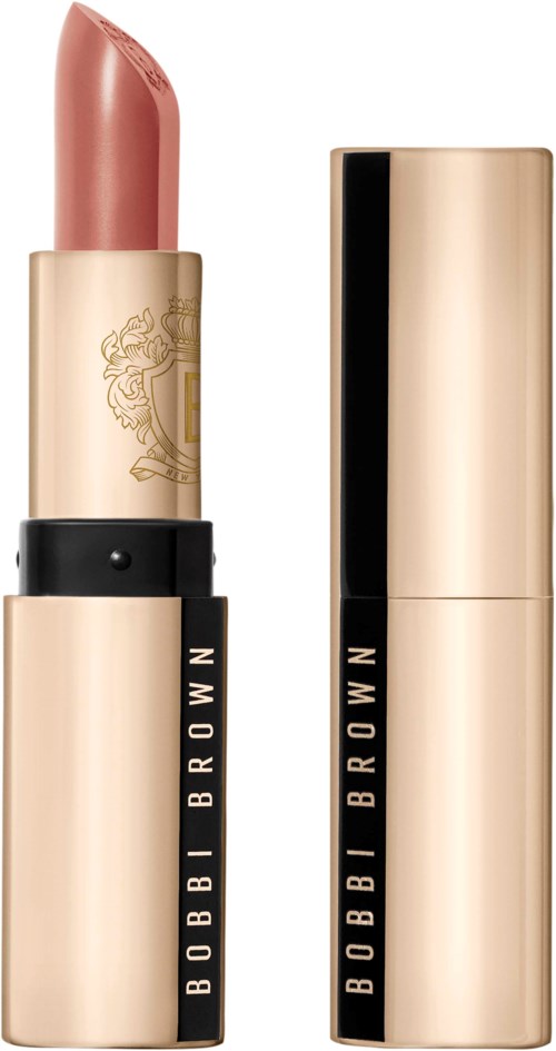 A beige lipstick case with black accents and the brand name Bobbi Brown. The cap is removed, showing pinkish lipstick.