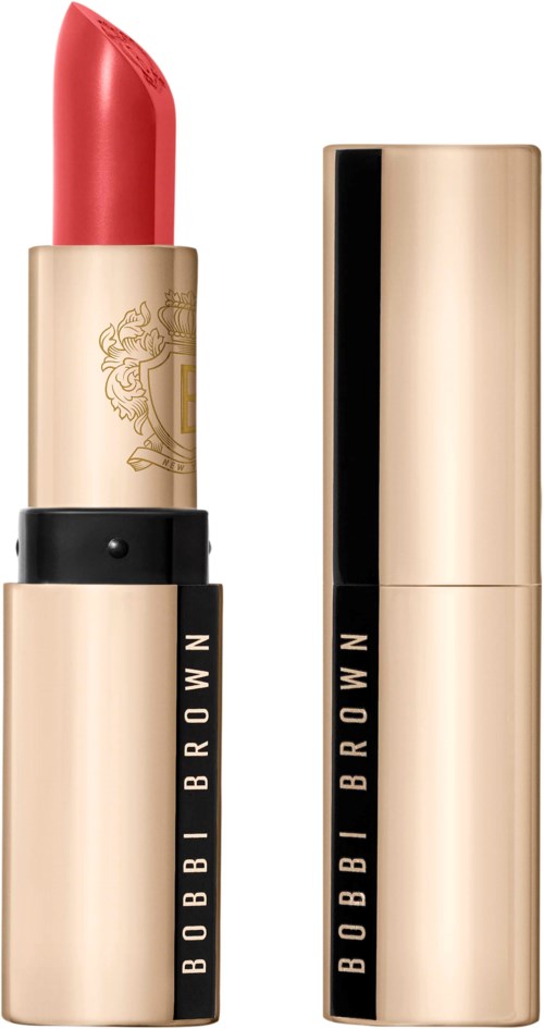 Bobbi Brown leppestift med gull- og svart emballasje, åpent for å vise rosaoransje farge.