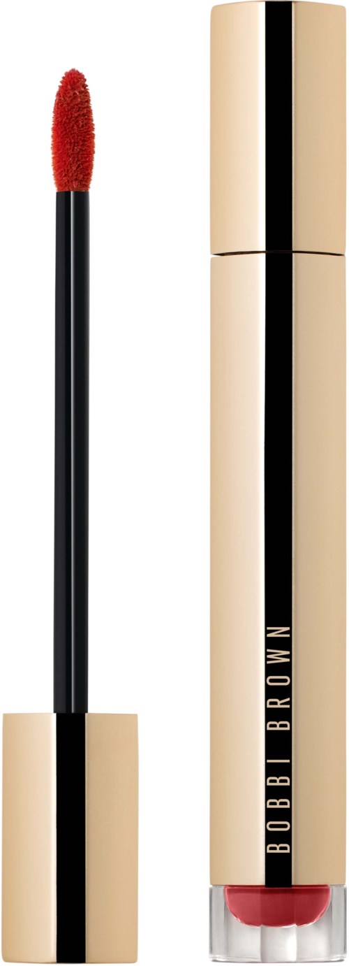 A lip gloss with a gold-colored tube and a red applicator. The brand name Bobbi Brown is on the tube.