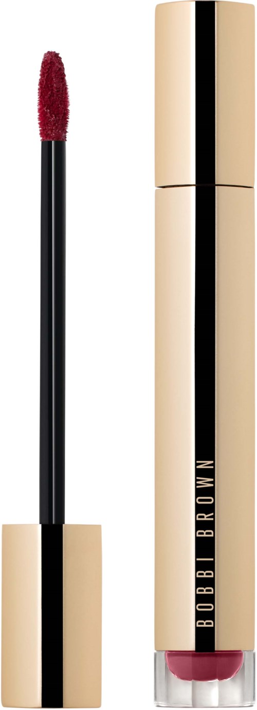 A liquid lipstick with a beige and black tube and a red applicator.
