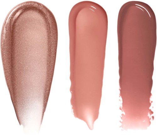 Tre olika läppstifts- eller läppglansprov i nude- och rosa nyanser.