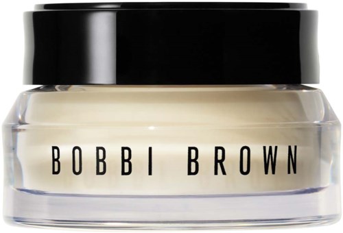 A small jar with a black lid and white cream inside, labeled BOBBI BROWN.