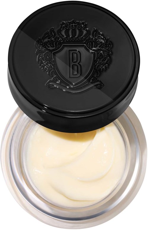 A small jar with cream inside and a black lid with a crest. The lid has a letter B and decorative details.
