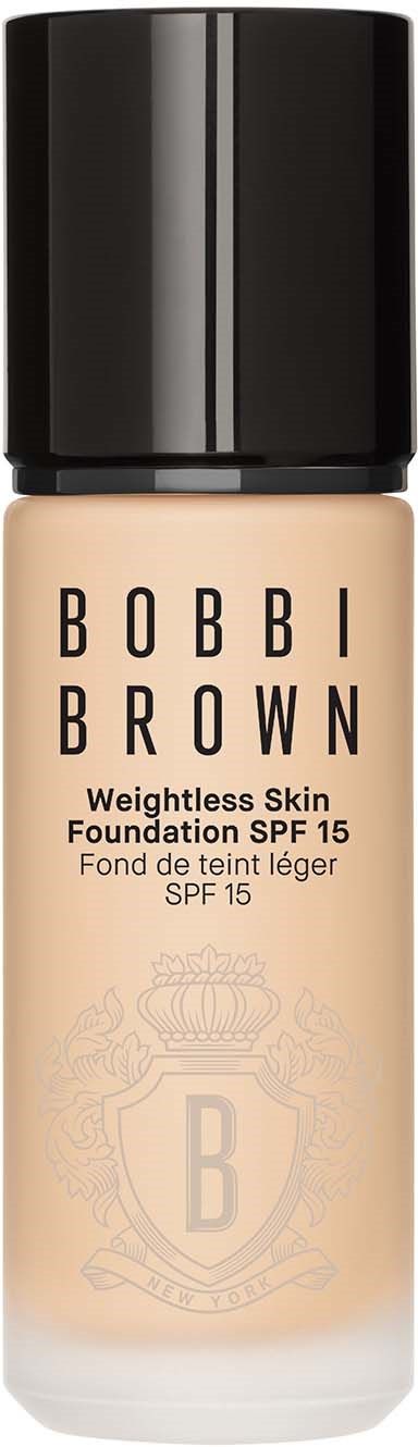 A bottle of Bobbi Brown foundation with SPF 15, label shows the product name and skin type.