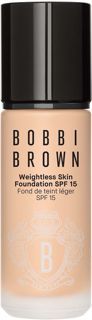 A foundation bottle with black cap, light beige color, and brand name Bobbi Brown on it.