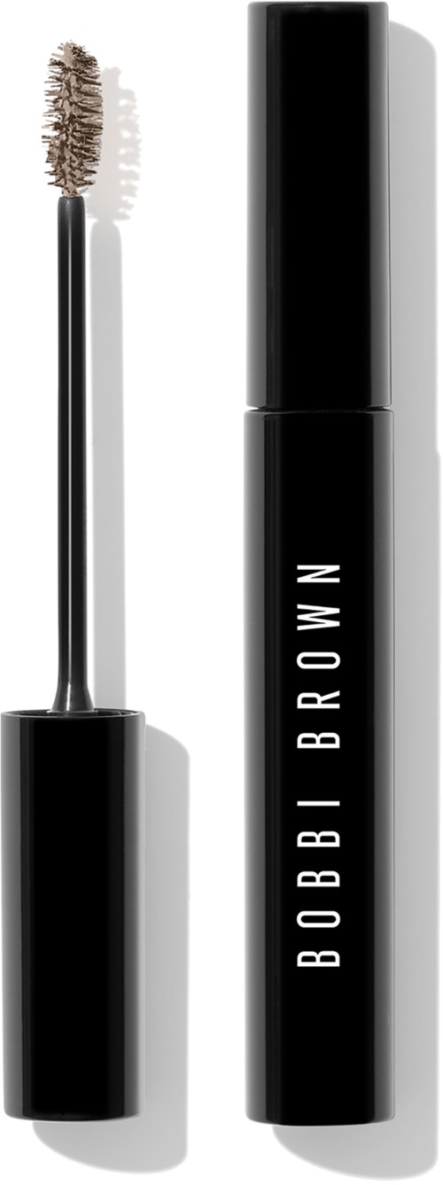 A black mascara bottle with the brand name 'BOBBI BROWN' and the wand nearby, shadowed on a light background.