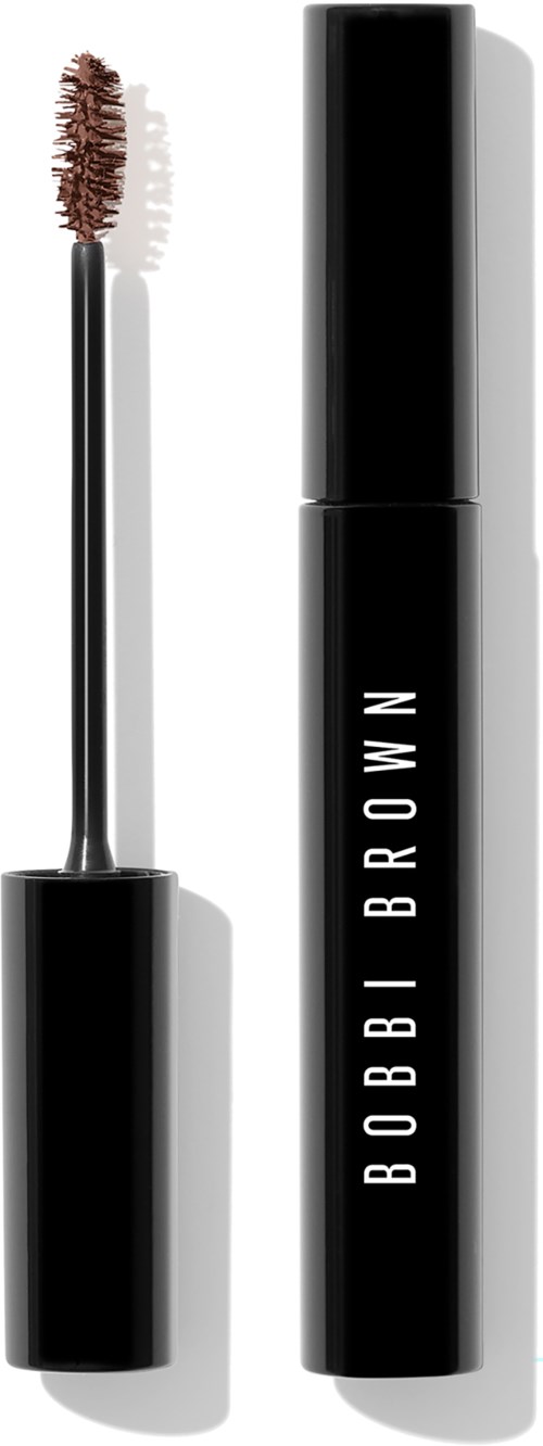 A mascara tube with a brush applicator next to it, both are black and white with 'BOBBI BROWN' written on the tube.