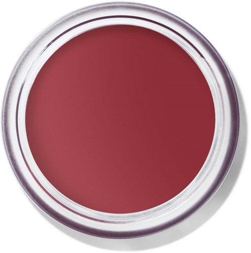 Een ronde container met een roze-rode substantie erin. De container heeft een doorzichtig deksel en een witte rand.