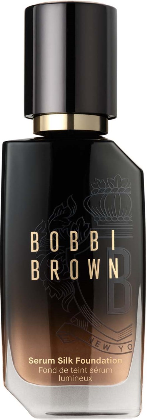 En svart och guldig flaska med Bobbi Brown serum silk foundation och svart lock.