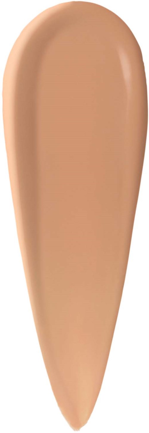 En beige flytande foundation prov på vit bakgrund.