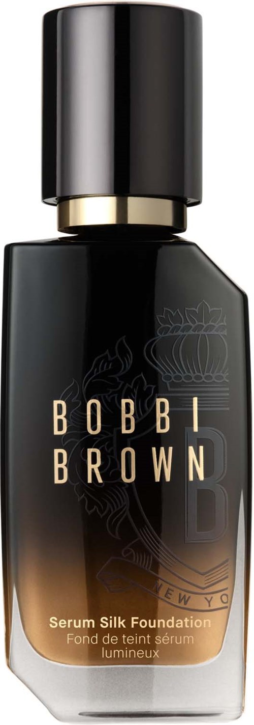 En svart flaska med Bobbi Brown Serum Silk Foundation med guldband och lock.