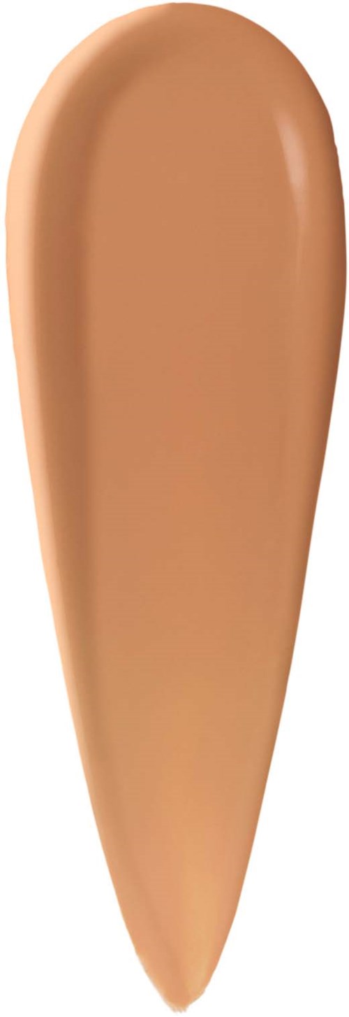 En tårformad prov av beige foundation eller concealer. Mjuk textur med lätt glans.