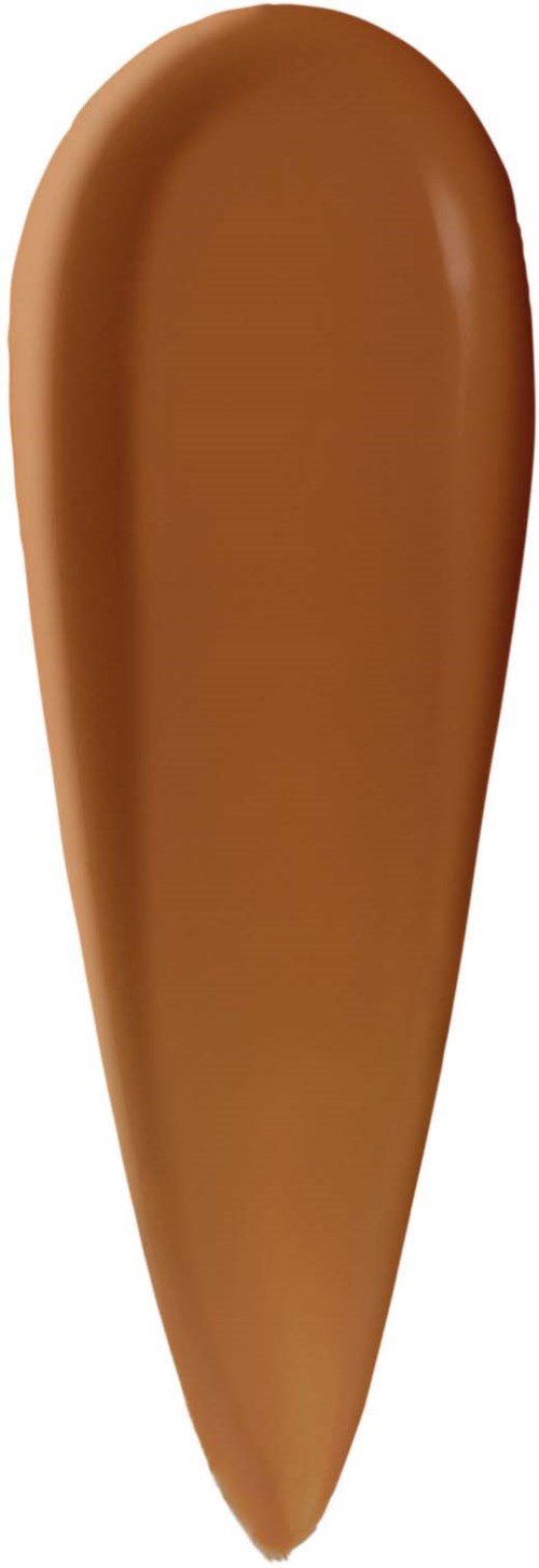Prov på varmbrun flytande foundation eller concealer med en slät, krämig konsistens.