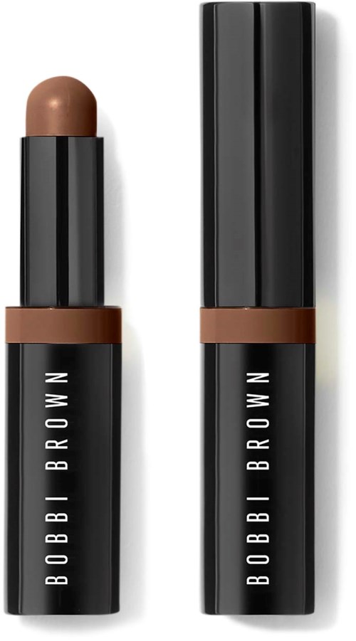 A makeup stick with a brown lipstick inside and a black case, with the Bobbi Brown logo.