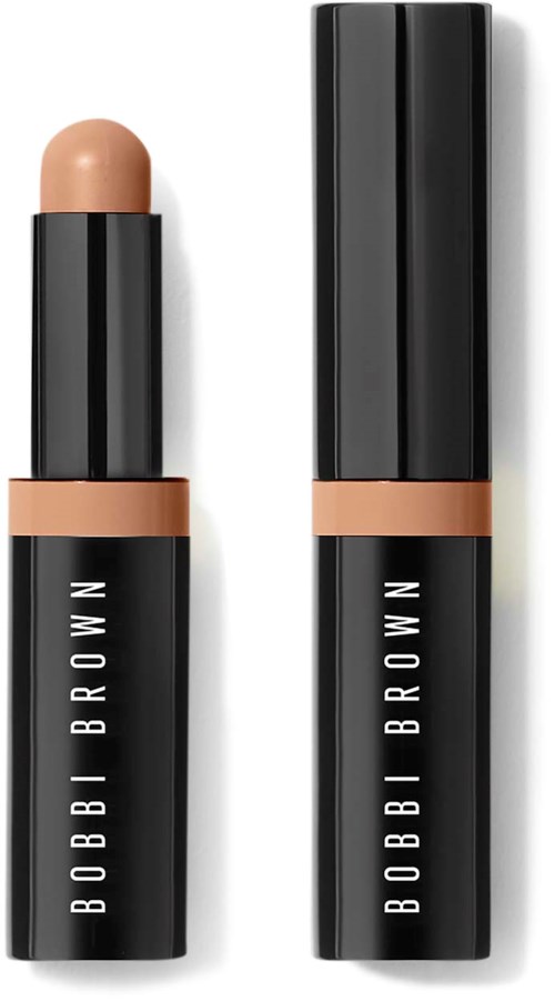 Two black tubes of Bobbi Brown makeup, one with a beige cap and lipstick, the other closed.