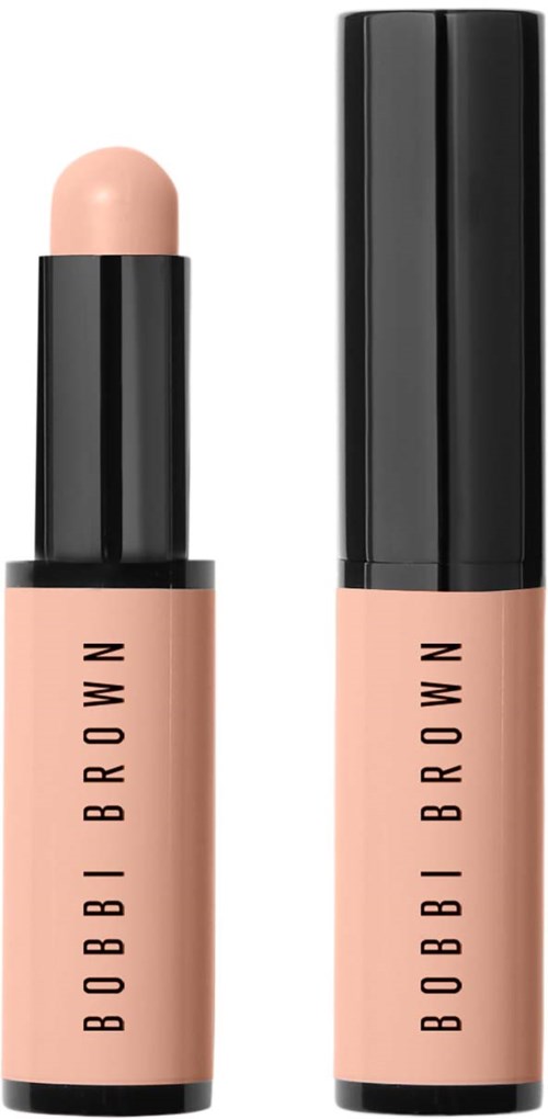 En skjønnhetsprodukt med svart lokk, hudfarget stift og rørmerke, merket "BOBBI BROWN".