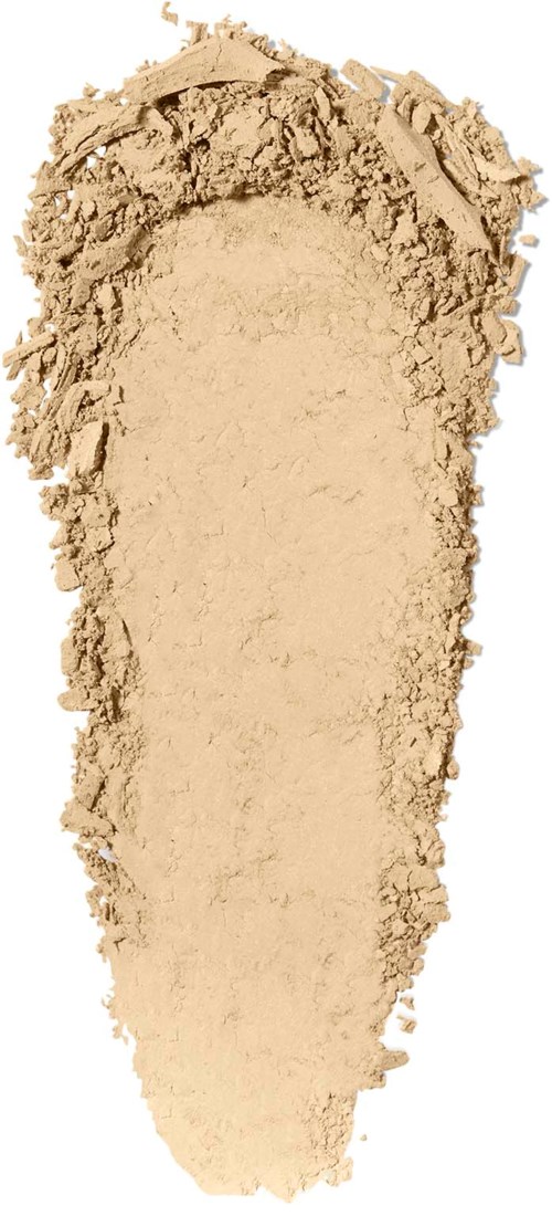 A beige powder spread unevenly, tapering at the bottom, with rough edges and a flat top.