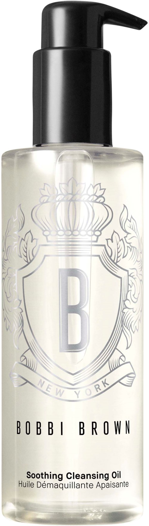 The image shows a clear bottle with a black pump, labeled 'BOBBI BROWN Soothing Cleansing Oil,' decorated with a crest and letter B.