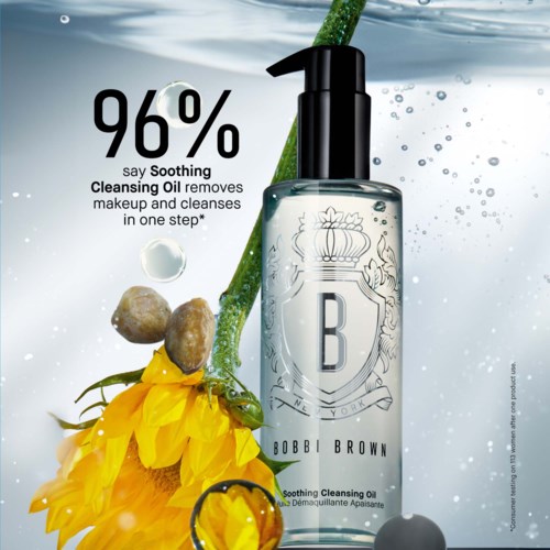 A bottle of cleansing oil with a yellow flower and green stalk, water bubbles, and text stating 96% soothing effectiveness.