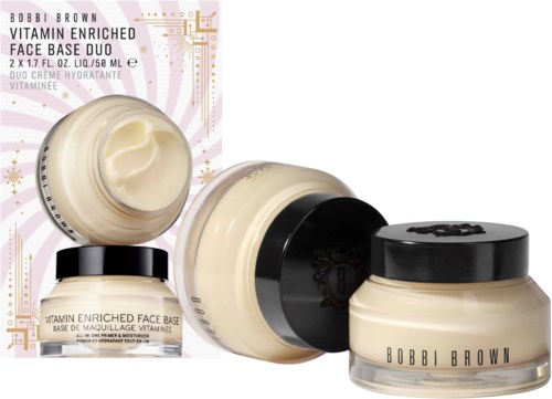 A set of skincare products in jars and a box, labeled as vitamin-enriched face cream duo by Bobbi Brown.