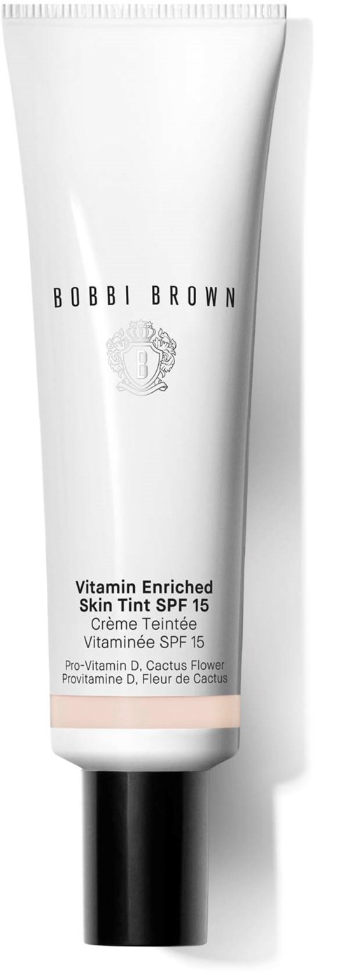 White tube of Vitamin Enriched Skin Tint SPF 15 with black cap. Brand: Bobbi Brown.