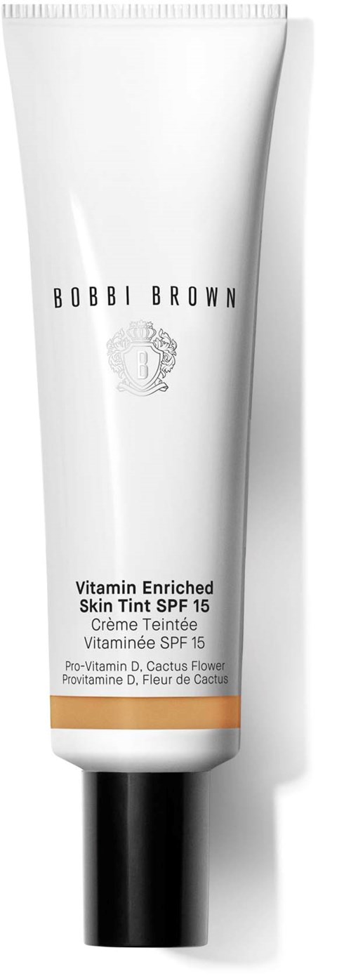 A white tube of Bobbi Brown skin tint with SPF 15, containing vitamin E and cactus flower extract.