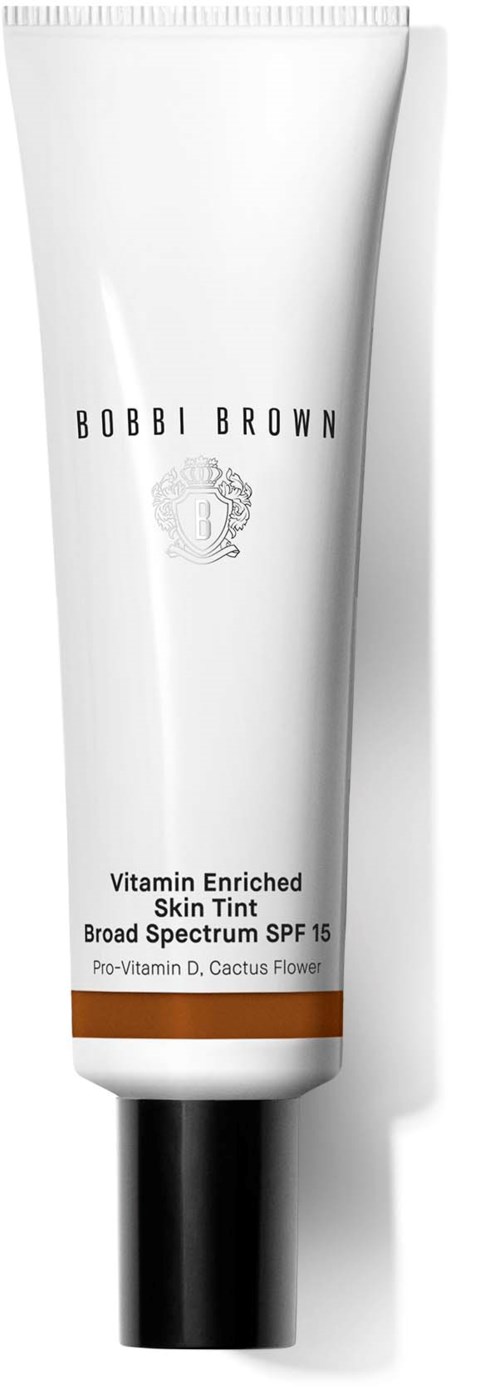 A white tube of skincare product labeled "Vitamin Enriched Skin Tint" with SPF 15 from Bobbi Brown.
