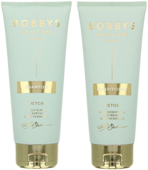 Twee lichtgroene tubes van Bobby's Hair Care producten, één voor shampoo en één voor conditioner, allebei gelabeld 'Detox'.