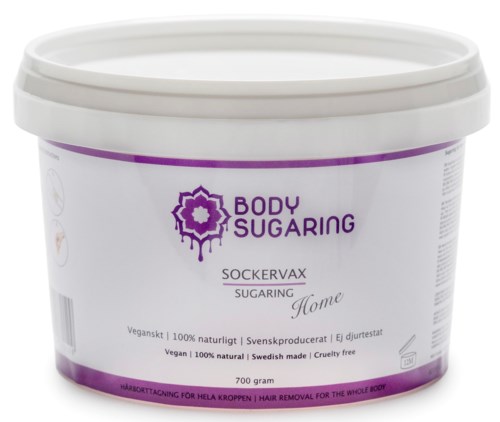 En vit plastbehållare märkt 'Body Sugaring' med lila och svart text. Den är för hårborttagning på hela kroppen.