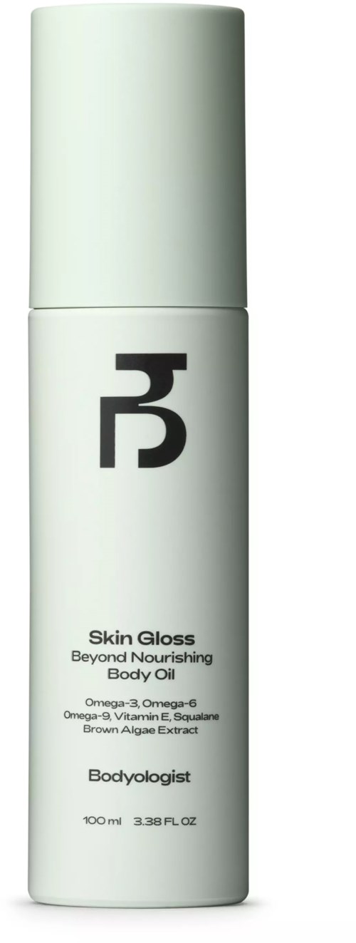 Weiße Flasche mit schwarzem Logo und Text, bezeichnet Skin Gloss von Bodyologist, enthält nährendes Körperöl.