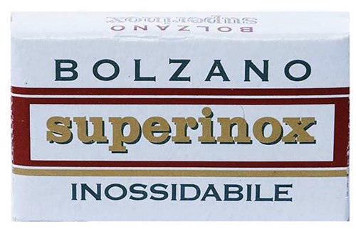A box with the words Bolzano, superinox, and INOSSIDABILE in bold letters, likely soap or cleaning product.