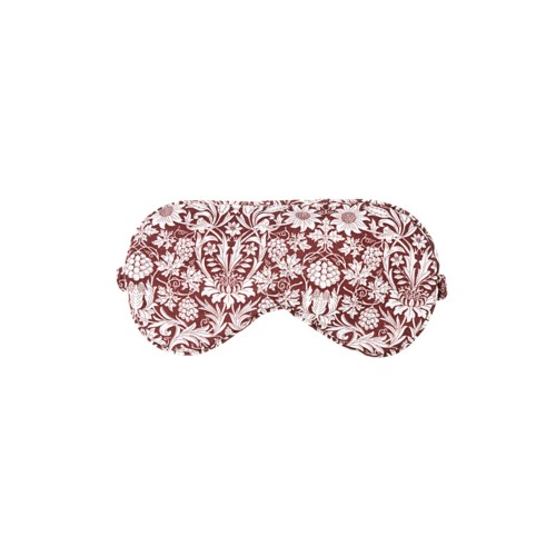 A pink floral patterned sleep mask with closed eyes design.