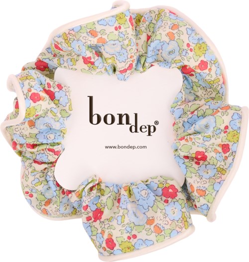 A floral patterned fabric with a white center labeled Bondep, surrounded by elastic edges for a secure fit.