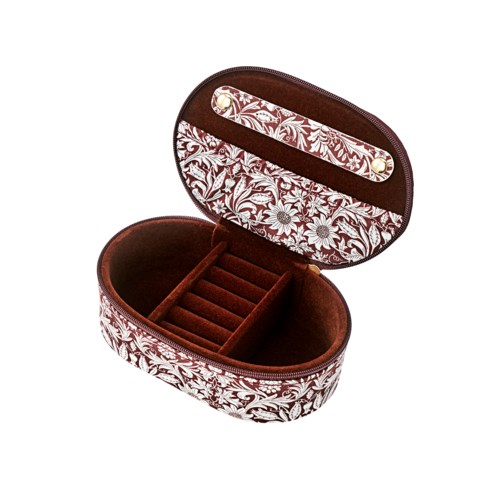 Floral patterned jewelry box with velvet interior and interior compartments for rings and small accessories.