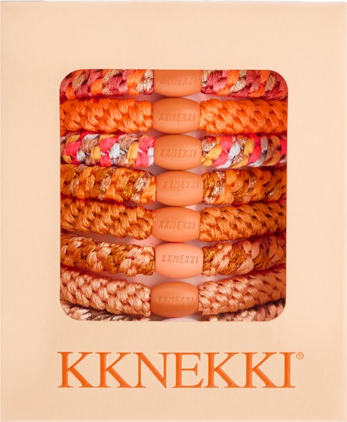 A box shows colorful, woven bracelets with the brand name KKNEKKI printed on the beads.
