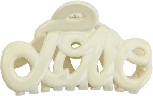 A cream-colored sign spells 'love' in cursive, with the word in the shape of a decorative script.