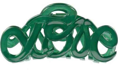 A green plastic object shaped like the word "love" in a script font.