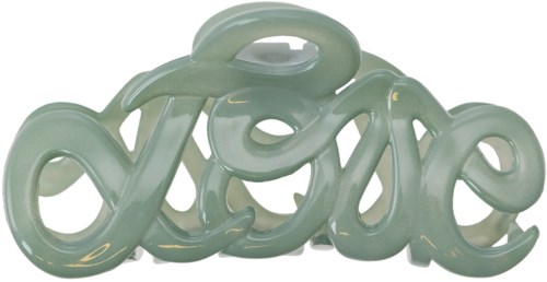 A decorative sculpture spelling "love" in a fancy, curvy style, made of smooth, shiny material.