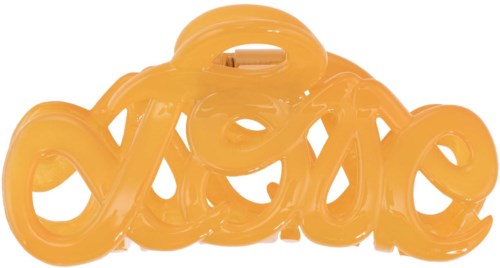 A yellow plastic object spells the word "love" in a curly, decorative style.