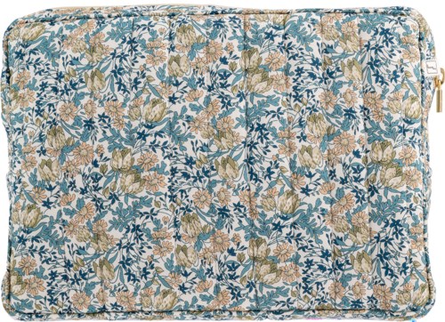 A floral-patterned fabric with beige and pink flowers and blue leaves, possibly a cushion or cover.