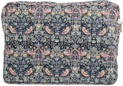 A pillow with a detailed pattern of pink, blue, and yellow birds and flowers on a dark background.