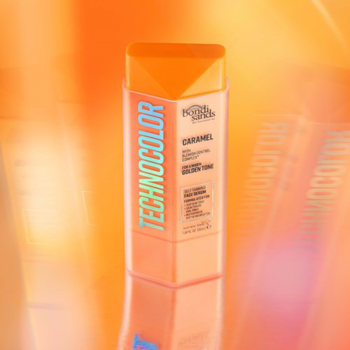 Cannes by Bondi Sands is a sun protection lotion for face, with a caramel golden tone, in an orange bottle.