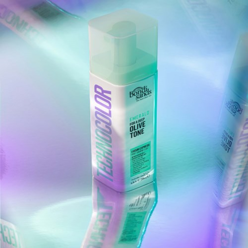 A bottle labeled 'Bondi Sands,' 'Emerald,' for a deep olive tone, with a colorful, reflective design.