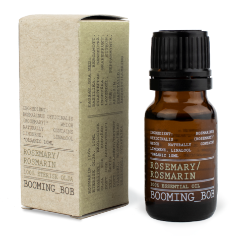 Kleine braune Flasche mit Rosmarin ätherischem Öl und schwarzem Fass, sowie eine beigefarbene Box mit Produktdetails. Für Aromatherapie.