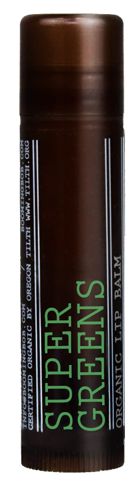 Ein brauner Stick mit der Aufschrift 'Super Crest' in grün und weiß, wahrscheinlich Lippenbalsam oder Kosmetikprodukt.