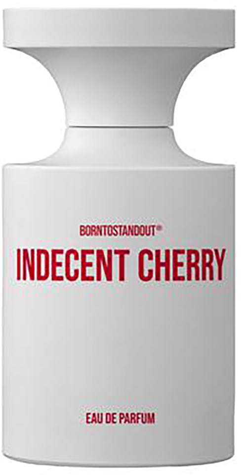 Een witte parfumfles met rode tekst, gelabeld 'Born to Stand Out Indecent Cherry Eau de Parfum.'