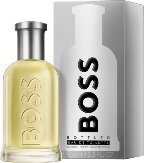 Ein Parfümflasche mit der Aufschrift 'BOSS' neben ihrer Verpackung, die 'BOTTLED EADE TOILETTE' sagt.